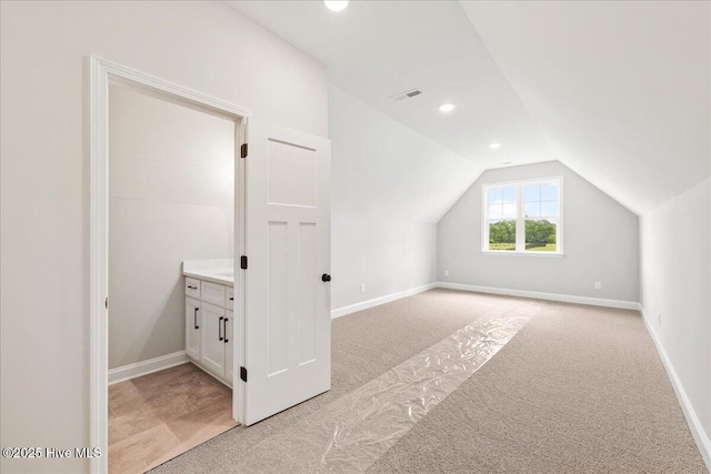 2259 Heartland Rd, Battleboro, NC 27809 - bonus room with light carpet, vaulted ceiling, baseboards, and recessed lighting