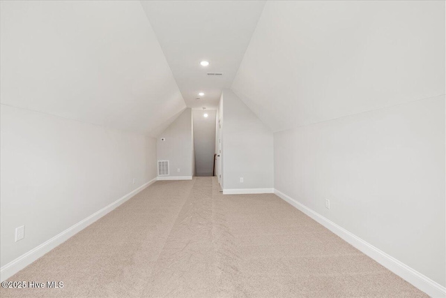 2259 Heartland Rd, Battleboro, NC 27809 - bonus room featuring light carpet, baseboards, lofted ceiling, and recessed lighting