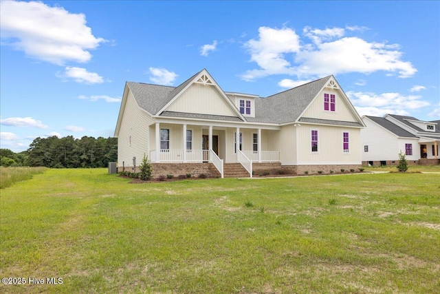 2259 Heartland Rd, Battleboro, NC 27809 - view of front of property with a porch, a front lawn, central air condition unit, roof with shingles, and crawl space