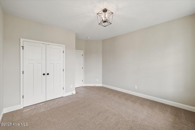 2259 Heartland Rd, Battleboro, NC 27809 - unfurnished bedroom featuring carpet flooring, baseboards, and a closet