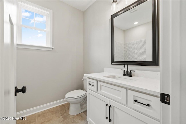 2259 Heartland Rd, Battleboro, NC 27809 - bathroom with baseboards, toilet, and vanity