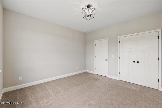 2259 Heartland Rd, Battleboro, NC 27809 - unfurnished bedroom with carpet floors, baseboards, and a closet