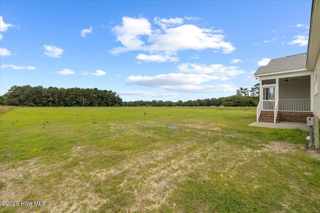 2259 Heartland Rd, Battleboro, NC 27809 - view of grassy yard with a rural view and a sunroom