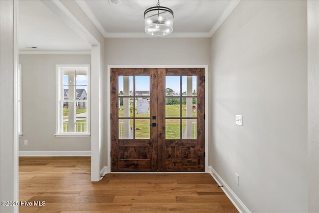 2259 Heartland Rd, Battleboro, NC 27809 - entrance foyer with wood finished floors, ornamental molding, french doors, baseboards, and a chandelier