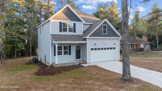 355 N Gaines St, Southern Pines, NC 28387 - view of front facade with roof with shingles, driveway, a porch, a front yard, and an attached garage