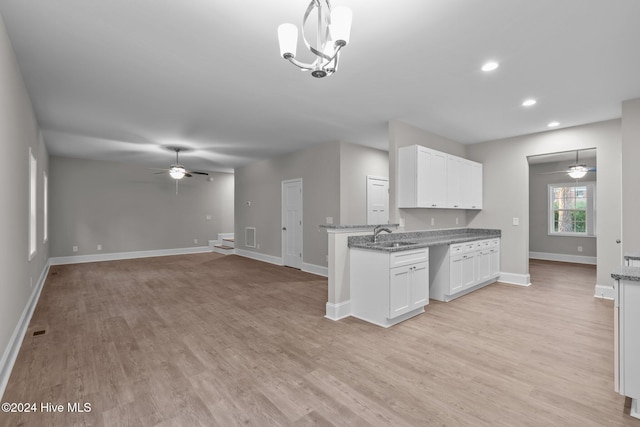 355 N Gaines St, Southern Pines, NC 28387 - kitchen with ceiling fan, baseboards, white cabinetry, light wood finished floors, and recessed lighting