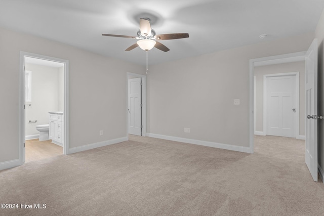 355 N Gaines St, Southern Pines, NC 28387 - unfurnished bedroom with light carpet, connected bathroom, baseboards, and ceiling fan