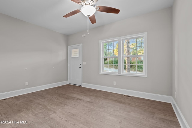 355 N Gaines St, Southern Pines, NC 28387 - spare room with wood finished floors, a ceiling fan, and baseboards