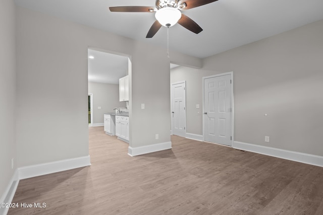 355 N Gaines St, Southern Pines, NC 28387 - unfurnished room with ceiling fan, baseboards, and light wood-style flooring