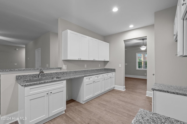 355 N Gaines St, Southern Pines, NC 28387 - kitchen with a sink, white cabinetry, light wood finished floors, recessed lighting, and ceiling fan