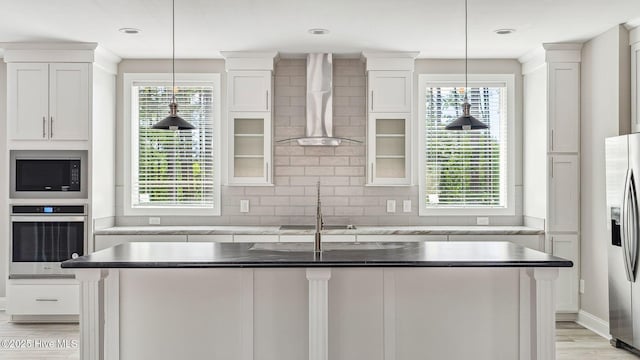 290 Boulder Dr, West End, NC 27376 - kitchen with appliances with stainless steel finishes, wall chimney range hood, and white cabinetry