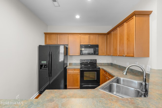 280 Coralstone Ct, Leland, NC 28451 - kitchen with black appliances, a sink, brown cabinetry, recessed lighting, and light countertops