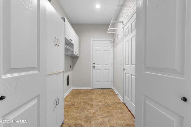 280 Coralstone Ct, Leland, NC 28451 - washroom with stone finish flooring, cabinet space, electric dryer hookup, and baseboards