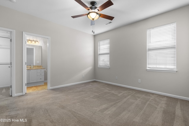 280 Coralstone Ct, Leland, NC 28451 - unfurnished bedroom featuring light colored carpet, baseboards, and connected bathroom