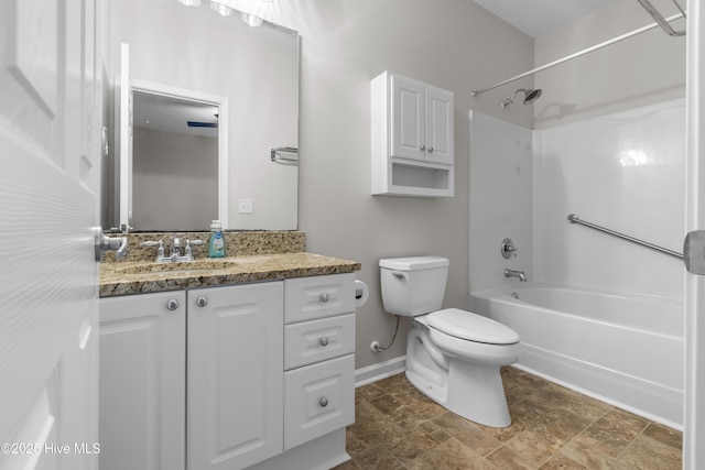 280 Coralstone Ct, Leland, NC 28451 - bathroom featuring toilet, vanity, tub / shower combination, baseboards, and stone finish floors
