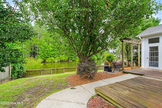 280 Coralstone Ct, Leland, NC 28451 - fenced backyard with a deck with water view and a pergola