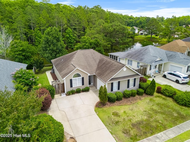 280 Coralstone Ct, Leland, NC 28451 - view of front of house with driveway, a shingled roof, and a garage