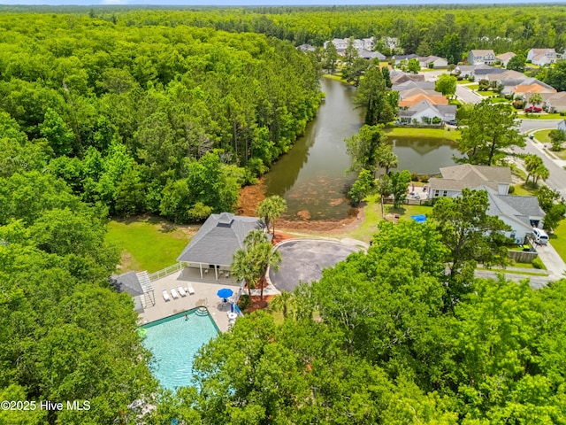 280 Coralstone Ct, Leland, NC 28451 - drone / aerial view of a forest, a nearby body of water, and a pool area