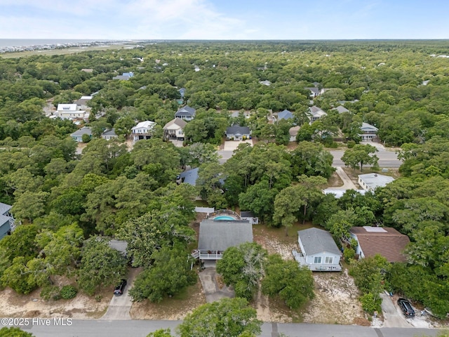 109 NE 1st St, Oak Island, NC 28465 - aerial view of residential area with a heavily wooded area