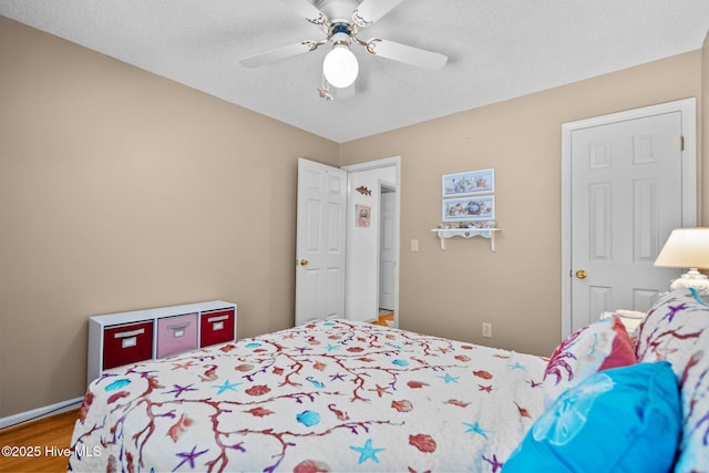 109 NE 1st St, Oak Island, NC 28465 - bedroom featuring wood finished floors and a ceiling fan