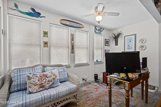 109 NE 1st St, Oak Island, NC 28465 - living room with ceiling fan, baseboards, and a desk