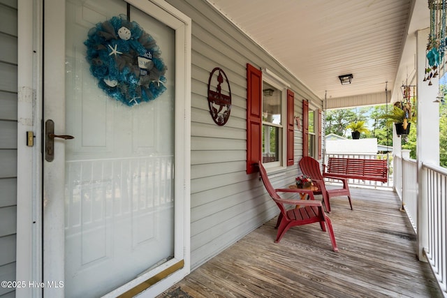 109 NE 1st St, Oak Island, NC 28465 - view of wooden porch