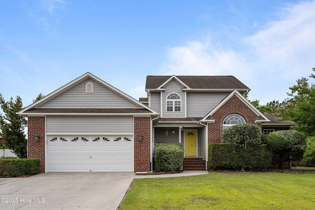 206 Lansing Ct, Jacksonville, NC 28540 - traditional home with concrete driveway, a front yard, a garage, brick siding, and a shingled roof