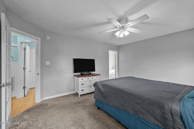 206 Lansing Ct, Jacksonville, NC 28540 - carpeted bedroom featuring baseboards and ceiling fan