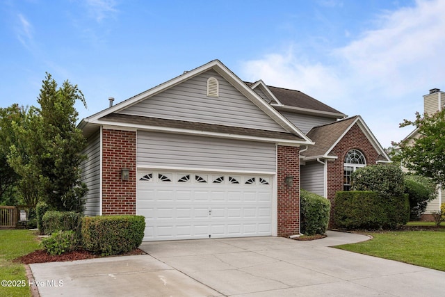 206 Lansing Ct, Jacksonville, NC 28540 - view of front of home featuring brick siding, driveway, an attached garage, roof with shingles, and a front lawn