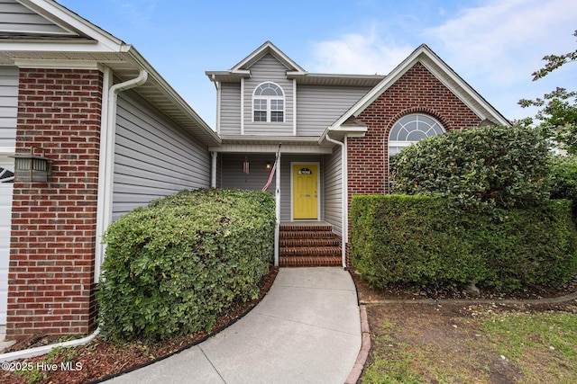 206 Lansing Ct, Jacksonville, NC 28540 - property entrance with brick siding