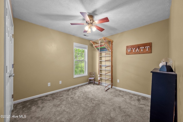 206 Lansing Ct, Jacksonville, NC 28540 - bedroom featuring carpet floors, baseboards, a textured ceiling, and ceiling fan