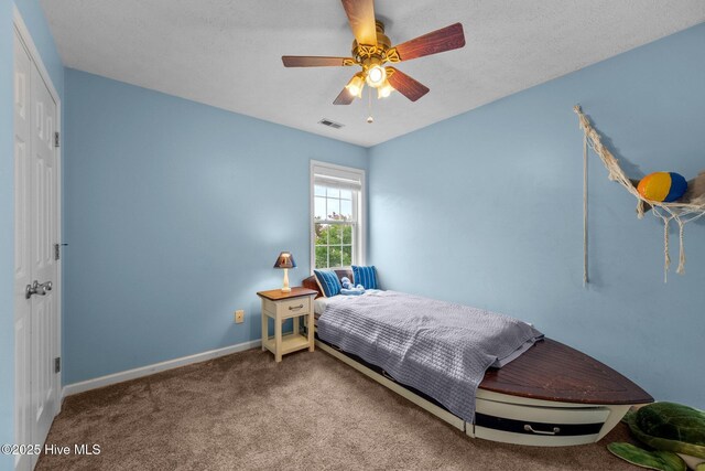 206 Lansing Ct, Jacksonville, NC 28540 - bedroom featuring carpet floors, baseboards, and a ceiling fan