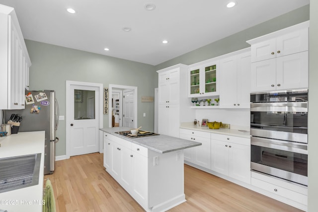 2021 Seawind Ln, Wilmington, NC 28405 - kitchen with stainless steel appliances, a center island, white cabinetry, and recessed lighting