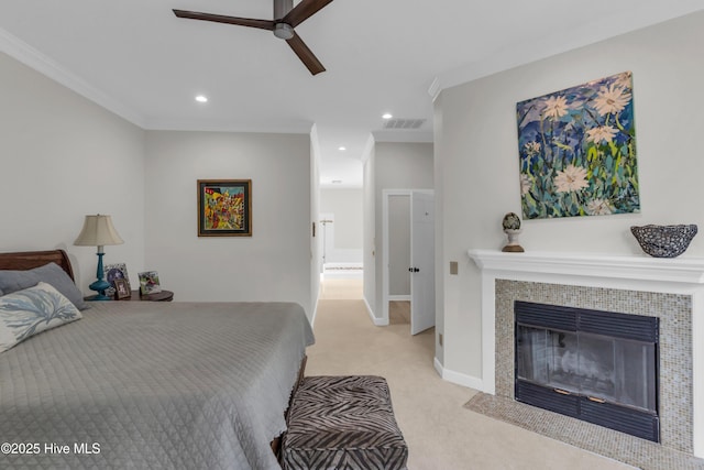 2021 Seawind Ln, Wilmington, NC 28405 - bedroom with light carpet, recessed lighting, a tile fireplace, crown molding, and ceiling fan