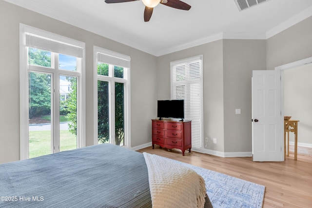 2021 Seawind Ln, Wilmington, NC 28405 - bedroom featuring light wood-style floors, baseboards, crown molding, and ceiling fan