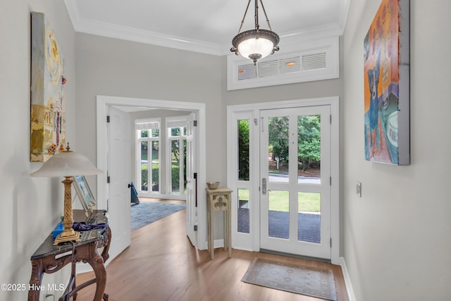 2021 Seawind Ln, Wilmington, NC 28405 - entryway with wood finished floors, crown molding, and baseboards