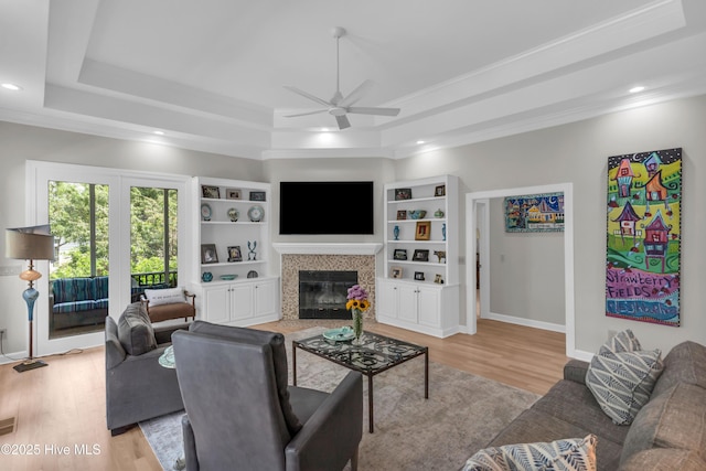 2021 Seawind Ln, Wilmington, NC 28405 - living room with ceiling fan, a raised ceiling, light wood-type flooring, recessed lighting, and baseboards