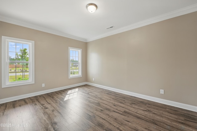 33 Chippewa Ln, Rocky Point, NC 28457 - spare room with baseboards, dark wood-style floors, and crown molding