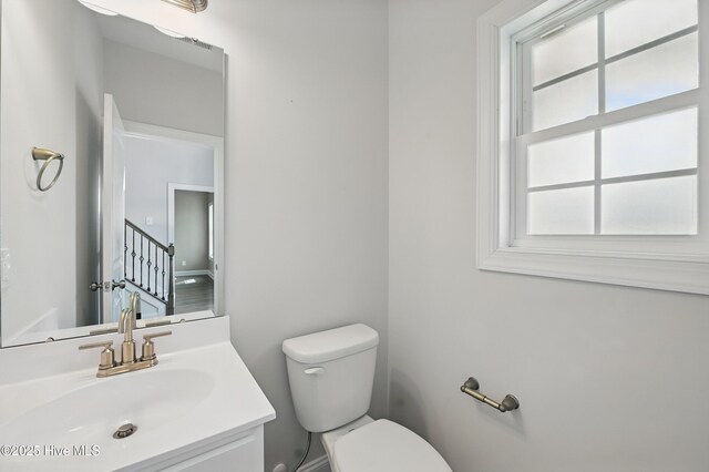 33 Chippewa Ln, Rocky Point, NC 28457 - bathroom featuring vanity, toilet, and baseboards