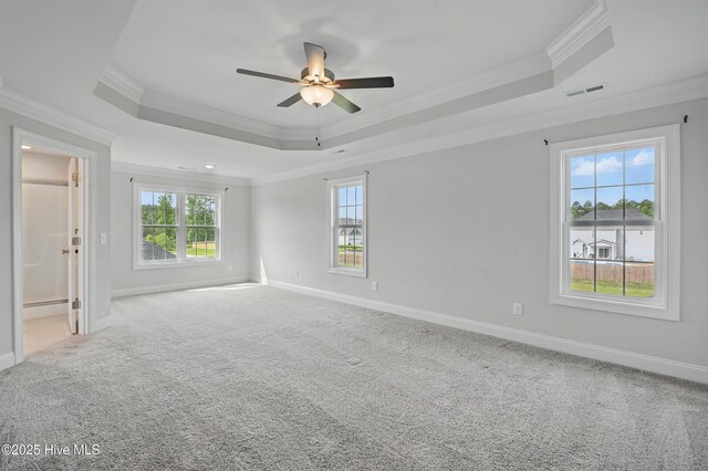 33 Chippewa Ln, Rocky Point, NC 28457 - carpeted empty room featuring a tray ceiling, crown molding, ceiling fan, and baseboards