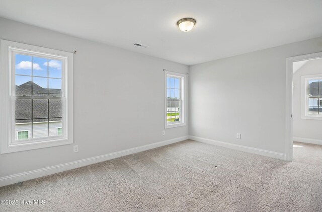 33 Chippewa Ln, Rocky Point, NC 28457 - spare room with plenty of natural light, baseboards, and carpet flooring