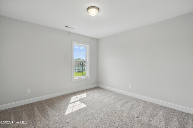 33 Chippewa Ln, Rocky Point, NC 28457 - empty room featuring baseboards and carpet flooring