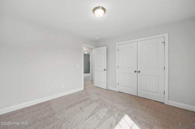 33 Chippewa Ln, Rocky Point, NC 28457 - unfurnished bedroom featuring carpet floors, baseboards, and a closet