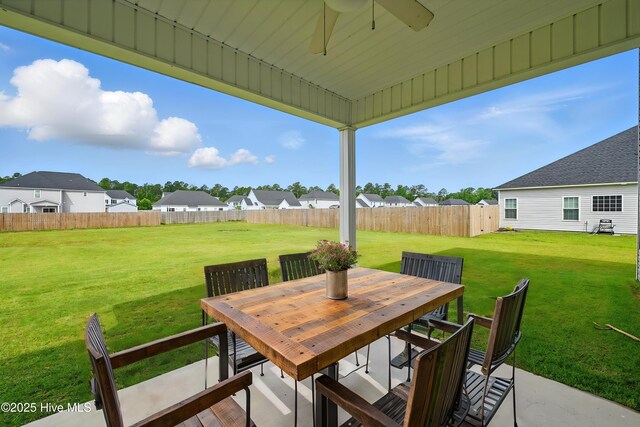 33 Chippewa Ln, Rocky Point, NC 28457 - view of patio / terrace with outdoor dining space, a ceiling fan, and a residential view