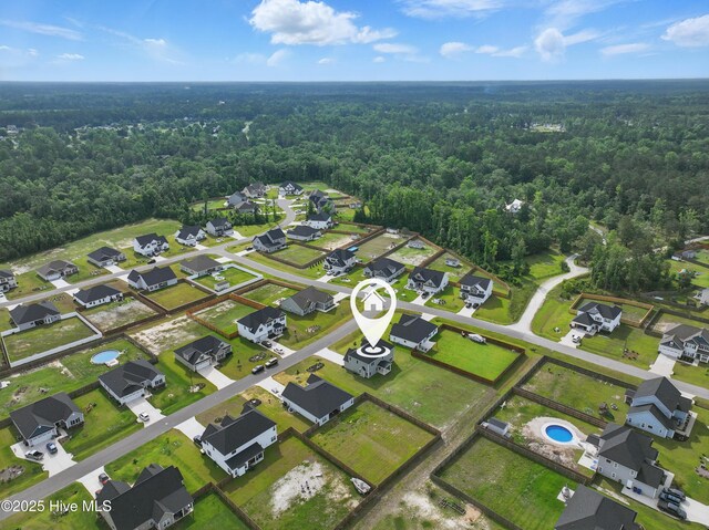 33 Chippewa Ln, Rocky Point, NC 28457 - aerial view of property and surrounding area featuring a forest