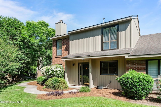 113 Sunshine Ln Unit C8, Winterville, NC 28590 - view of front of property with a chimney, roof with shingles, and brick siding