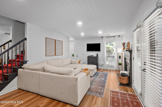 113 Sunshine Ln Unit C8, Winterville, NC 28590 - living area featuring wood finished floors, stairs, recessed lighting, and a fireplace