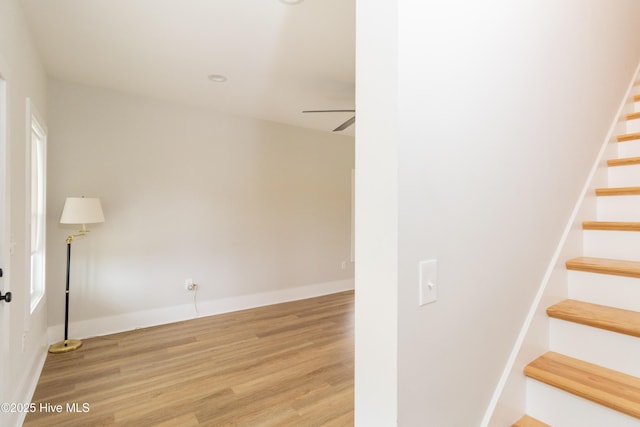 245 Winborne Ln, Edenton, NC 27932 - stairs featuring ceiling fan, wood finished floors, and baseboards