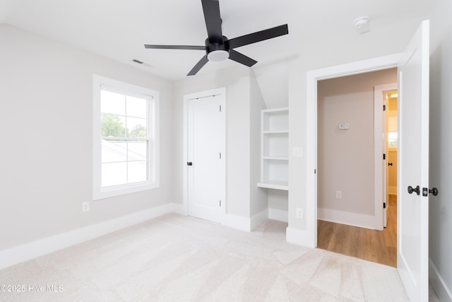 245 Winborne Ln, Edenton, NC 27932 - unfurnished bedroom featuring carpet flooring, baseboards, ceiling fan, and a closet
