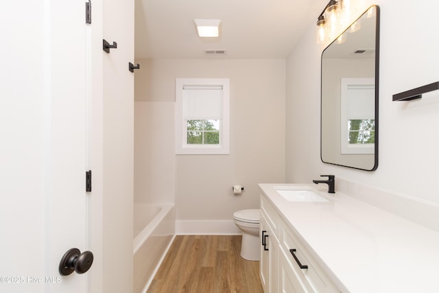 245 Winborne Ln, Edenton, NC 27932 - full bathroom featuring vanity, wood finished floors, toilet, baseboards, and a tub